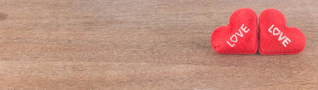 Valentines day background with red hearts  on wooden  backgroundの写真素材
