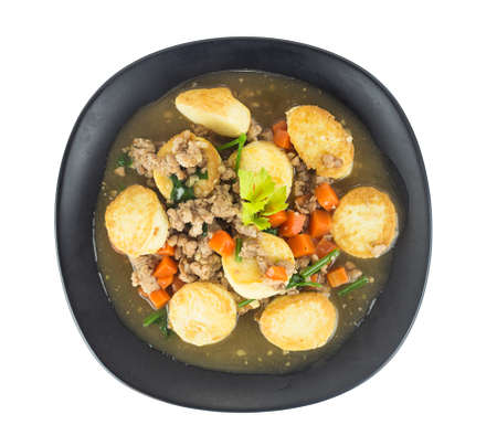 Stir fried tofu with pork and carrot on white backgroundの写真素材