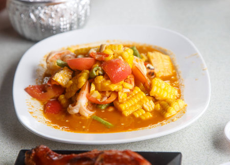 Thai food - Dish of spicy salad with corn and shrimpの写真素材