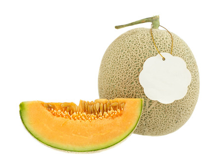 Fresh slice melon fruit - food for good health with blank tag  isolated on white backgroundの写真素材