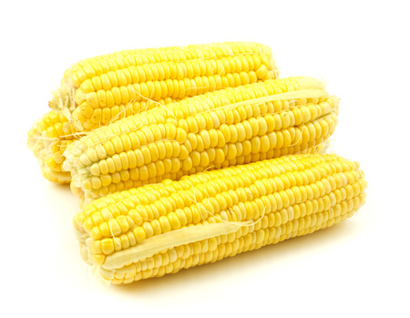 Heap of fresh corns on white background