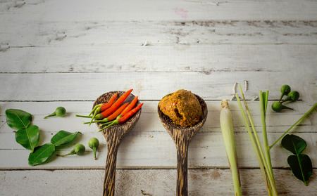 Spicies and herbs - fresh chilli and spicy curry on whiteの写真素材
