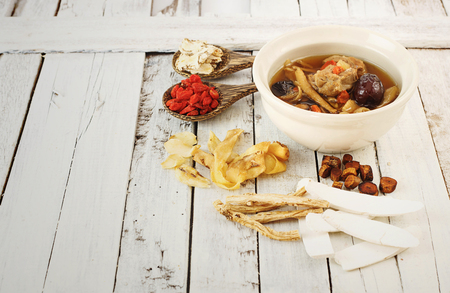 Pork rips clear soup with chinese medicine  on white backgroundの写真素材