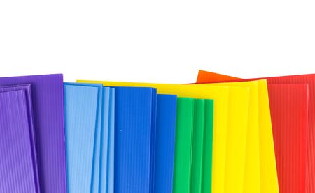 Top view of colorful corrugated plastics isolated on whiteの写真素材