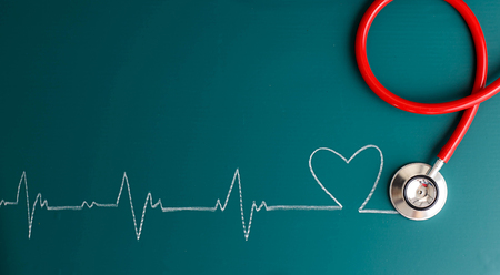Top view of stethoscope and heartbeat make a heartの写真素材