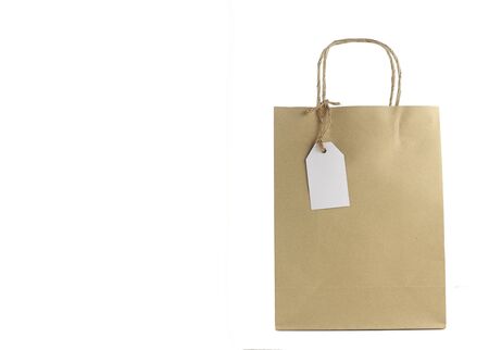 Brown shopping bag with blank tag isolated on white backgroundの写真素材
