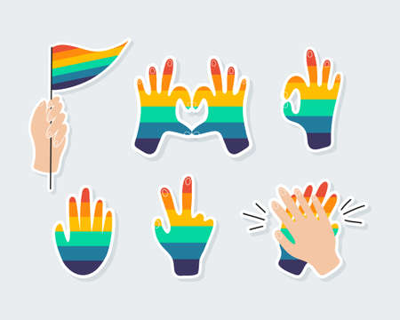 Set of icons on a theme the LGBTQ. Various rainbow hands, hands-heart, hand with a rainbow flag, peace sign. Gay Pride Month. All elements are isolatedのイラスト素材