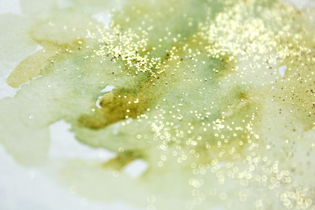 Abstract watercolor glittery background. Dreamy, blurred, magical backdrop. Elegant, feminine, soft light, golden abstraction.の写真素材