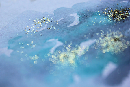 Abstract watercolor glittery background. Dreamy, blurred, magical backdrop. Elegant, feminine, soft light, golden abstraction.の写真素材