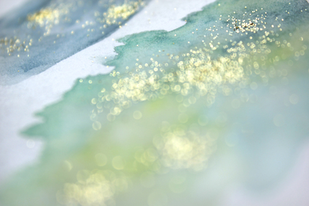 Abstract watercolor glittery background. Dreamy, blurred, magical backdrop. Elegant, feminine, soft light, golden abstraction.の写真素材