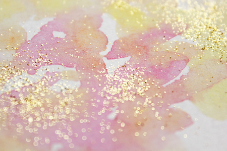 Abstract watercolor glittery background. Dreamy, blurred, magical backdrop. Elegant, feminine, soft light, golden abstraction.の写真素材