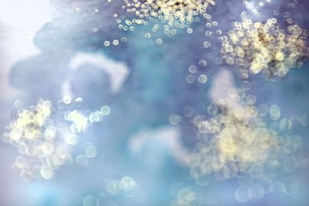 Abstract watercolor glittery background. Dreamy, blurred, magical backdrop. Elegant, feminine, soft light, golden abstraction.の写真素材