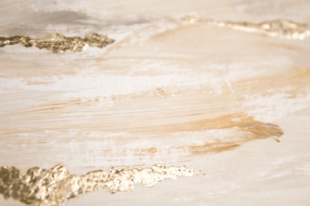 Christmas elegant background. Blurred abstract art gold foil backdrop. Luxury glamorous shiny...