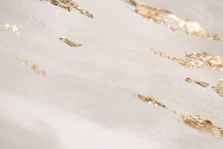 Christmas elegant background. Blurred abstract art gold foil backdrop. Luxury glamorous shiny festive soft wallpaper. Stylish, trendy and posh abstraction. Chic feminine neutral nude beige background.の写真素材