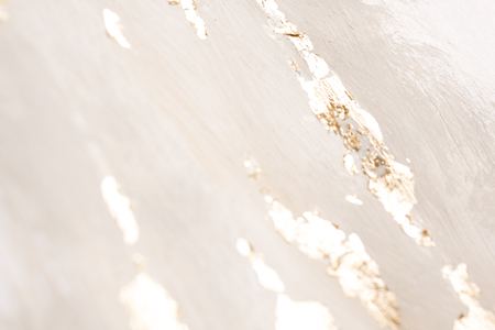 Christmas elegant background. Blurred abstract art gold foil backdrop. Luxury glamorous shiny festive soft wallpaper. Stylish, trendy and posh abstraction. Chic feminine neutral nude beige background.の写真素材