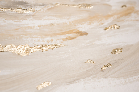 Christmas elegant background. Blurred abstract art gold foil backdrop. Luxury glamorous shiny festive soft wallpaper. Stylish, trendy and posh abstraction. Chic feminine neutral nude beige background.の写真素材