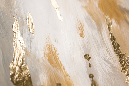 Christmas elegant background. Blurred abstract art gold foil backdrop. Luxury glamorous shiny festive soft wallpaper. Stylish, trendy and posh abstraction. Chic feminine neutral nude beige background.の写真素材