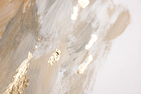 Christmas elegant background. Blurred abstract art gold foil backdrop. Luxury glamorous shiny festive soft wallpaper. Stylish, trendy and posh abstraction. Chic feminine neutral nude beige background.の写真素材