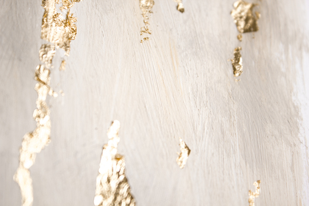 Christmas elegant background. Blurred abstract art gold foil backdrop. Luxury glamorous shiny festive soft wallpaper. Stylish, trendy and posh abstraction. Chic feminine neutral nude beige background.の写真素材