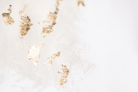 Christmas elegant background. Blurred abstract art gold foil backdrop. Luxury glamorous shiny festive soft wallpaper. Stylish, trendy and posh abstraction. Chic feminine neutral nude beige background.の写真素材