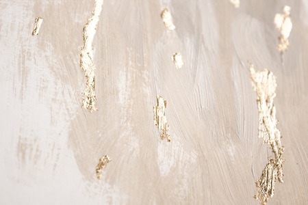 Christmas elegant background. Blurred abstract art gold foil backdrop. Luxury glamorous shiny festive soft wallpaper. Stylish, trendy and posh abstraction. Chic feminine neutral nude beige background.の写真素材