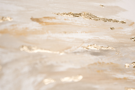 Christmas elegant background. Blurred abstract art gold foil backdrop. Luxury glamorous shiny festive soft wallpaper. Stylish, trendy and posh abstraction. Chic feminine neutral nude beige background.の写真素材