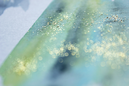 Abstract  glittery background. Dreamy, blurred, magical backdrop. Elegant, feminine, soft light, golden abstraction.の写真素材
