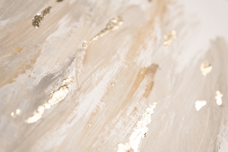 Christmas elegant background. Blurred abstract art gold foil backdrop. Luxury glamorous shiny festive soft wallpaper. Stylish, trendy and posh abstraction. Chic feminine neutral nude beige background.の写真素材