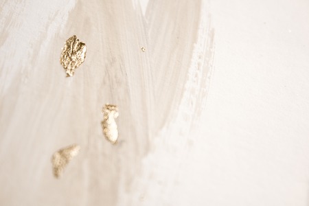 Christmas elegant background. Blurred abstract art gold foil backdrop. Luxury glamorous shiny festive soft wallpaper. Stylish, trendy and posh abstraction. Chic feminine neutral nude beige background.の写真素材