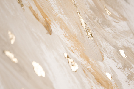 Christmas elegant background. Blurred abstract art gold foil backdrop. Luxury glamorous shiny festive soft wallpaper. Stylish, trendy and posh abstraction. Chic feminine neutral nude beige background.の写真素材