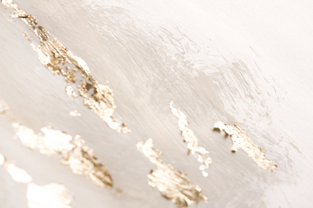 Christmas elegant background. Blurred abstract art gold foil backdrop. Luxury glamorous shiny festive soft wallpaper. Stylish, trendy and posh abstraction. Chic feminine neutral nude beige background.の写真素材
