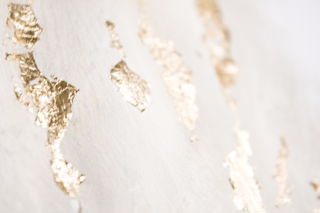 Christmas elegant background. Blurred abstract art gold foil backdrop. Luxury glamorous shiny festive soft wallpaper. Stylish, trendy and posh abstraction. Chic feminine neutral nude beige background.の写真素材