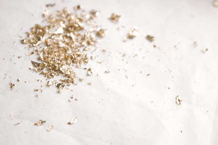 Christmas elegant background. Blurred abstract art gold glitter backdrop. Luxury glamorous shiny festive soft wallpaper. Stylish, trendy posh abstraction. Chic feminine neutral nude beige background.の写真素材