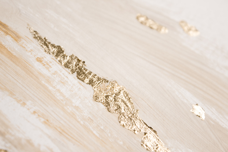 Christmas elegant background. Blurred abstract art gold foil backdrop. Luxury glamorous shiny festive soft wallpaper. Stylish, trendy and posh abstraction. Chic feminine neutral nude beige background.の写真素材