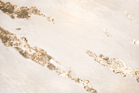 Christmas elegant background. Blurred abstract art gold foil backdrop. Luxury glamorous shiny festive soft wallpaper. Stylish, trendy and posh abstraction. Chic feminine neutral nude beige background.の写真素材