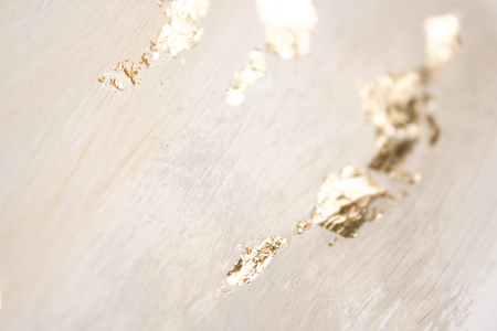 Christmas elegant background. Blurred abstract art gold foil backdrop. Luxury glamorous shiny festive soft wallpaper. Stylish, trendy and posh abstraction. Chic feminine neutral nude beige background.の写真素材