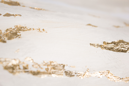 Christmas elegant background. Blurred abstract art gold foil backdrop. Luxury glamorous shiny festive soft wallpaper. Stylish, trendy and posh abstraction. Chic feminine neutral nude beige background.の写真素材