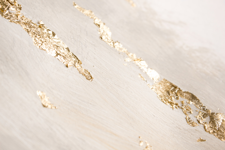 Christmas elegant background. Blurred abstract art gold foil backdrop. Luxury glamorous shiny festive soft wallpaper. Stylish, trendy and posh abstraction. Chic feminine neutral nude beige background.の写真素材