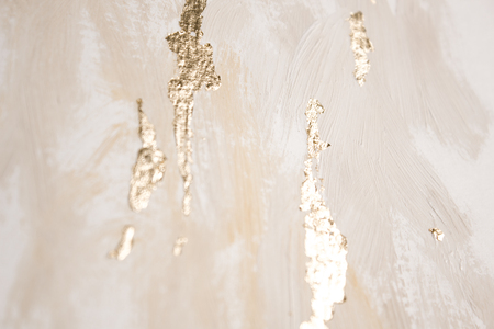 Christmas elegant background. Blurred abstract art gold foil backdrop. Luxury glamorous shiny festive soft wallpaper. Stylish, trendy and posh abstraction. Chic feminine neutral nude beige background.の写真素材