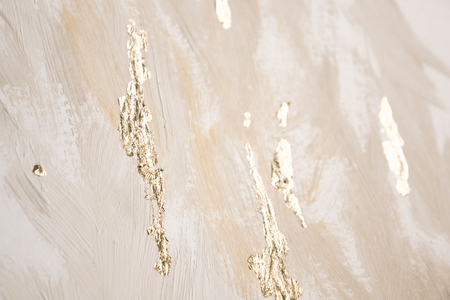Christmas elegant background. Blurred abstract art gold foil backdrop. Luxury glamorous shiny festive soft wallpaper. Stylish, trendy and posh abstraction. Chic feminine neutral nude beige background.の写真素材