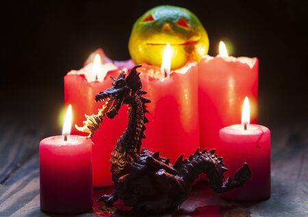 Halloween theme with figurines and candlesの写真素材