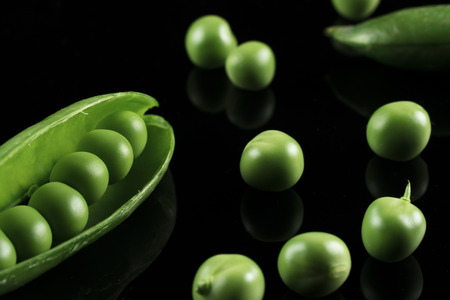 Peas on black backgroundの写真素材