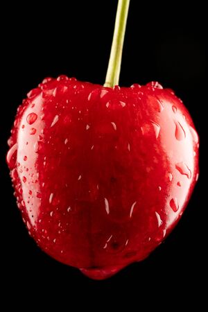 ripe red cherry with dropの写真素材