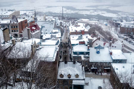 Old Quebec city during snowfall from aboveの写真素材