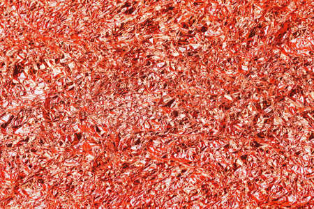 Shiny red  leaf foil texture background.の写真素材