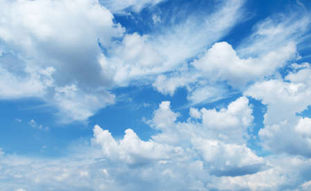 Fantastic soft white clouds against blue sky background soft focus.