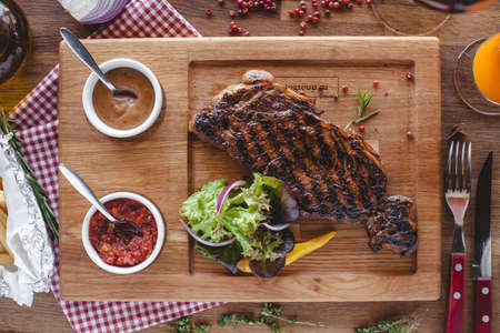 meat wooden board tablewear lettuce red food