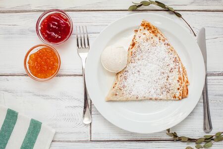 thin pancakes with jam honey and sour cream and coffeeの写真素材
