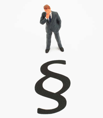 businessworld, man standing infront of law signの写真素材