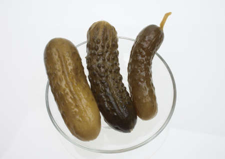 pickled cucumber or sour gherkin over whiteの写真素材